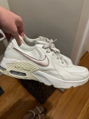 Nike Women's White Sneakers with Metallic Pink Swoosh